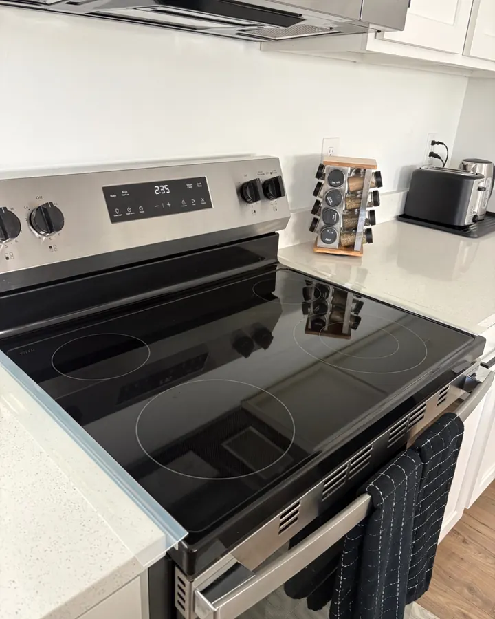 After: the same stovetop polished black.