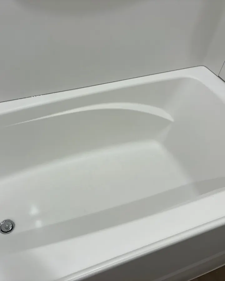 After: the tub clean and bright.