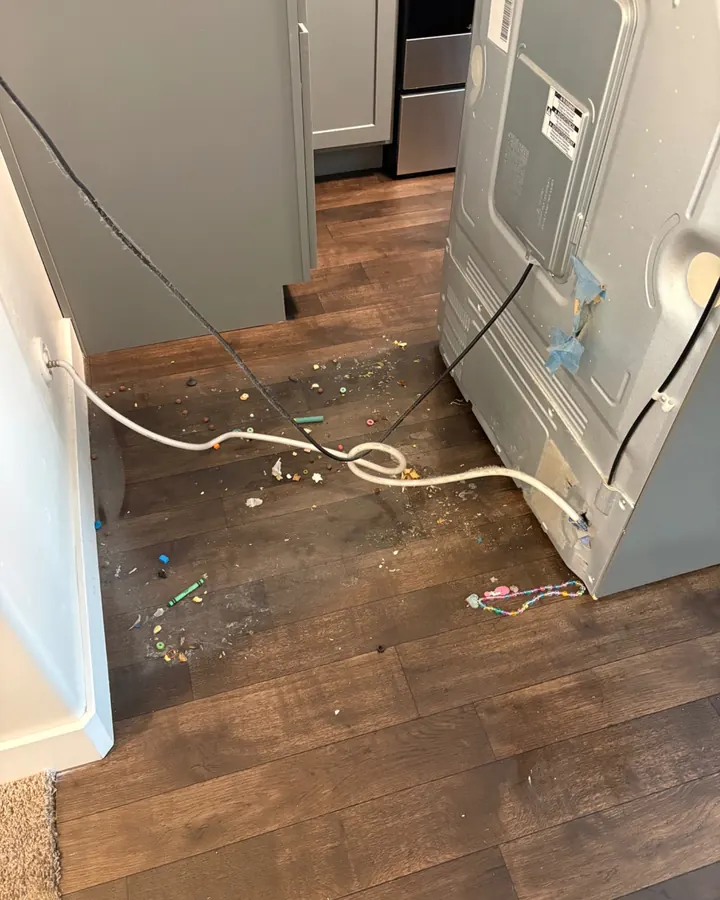 Before: crumbs and debris on the floor where a refrigerator stood.