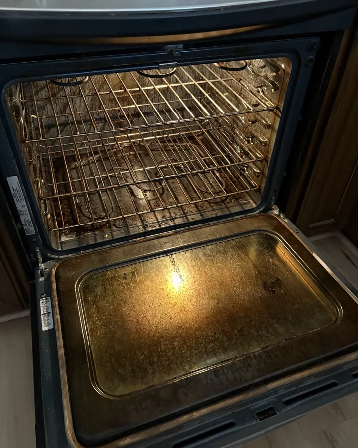 Before: an open oven with a greasy door and stained racks.