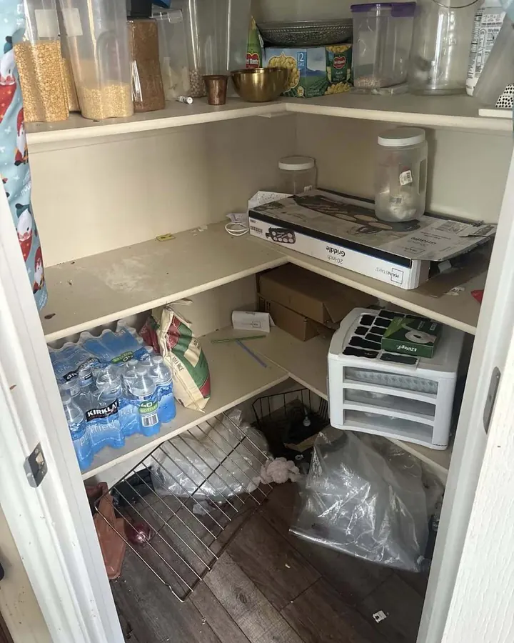 Before: a pantry with boxes and bags piled on the floor.